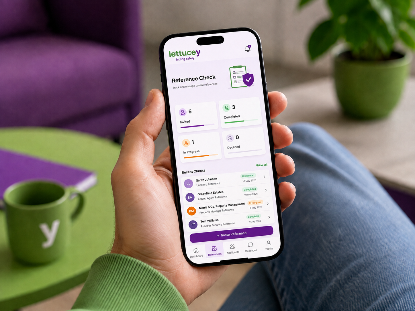 A hand holding a phone displaying an illustrative Lettucey reference dashboard