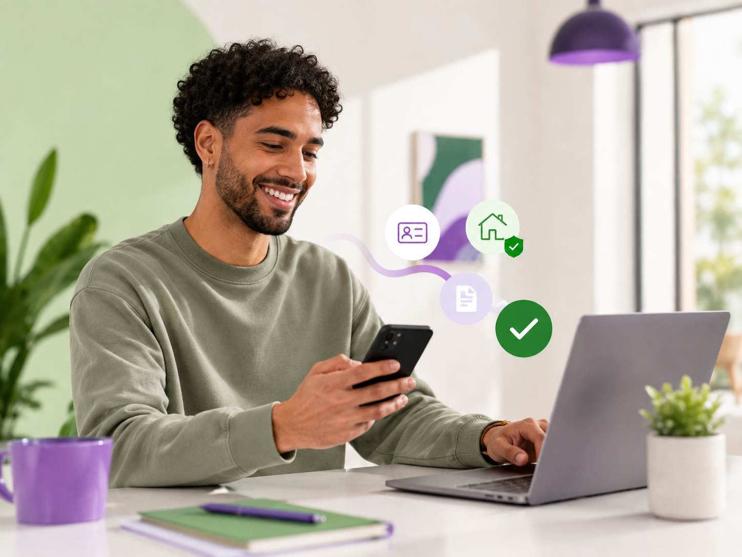 An applicant completing his Lettucey application on a phone beside his laptop